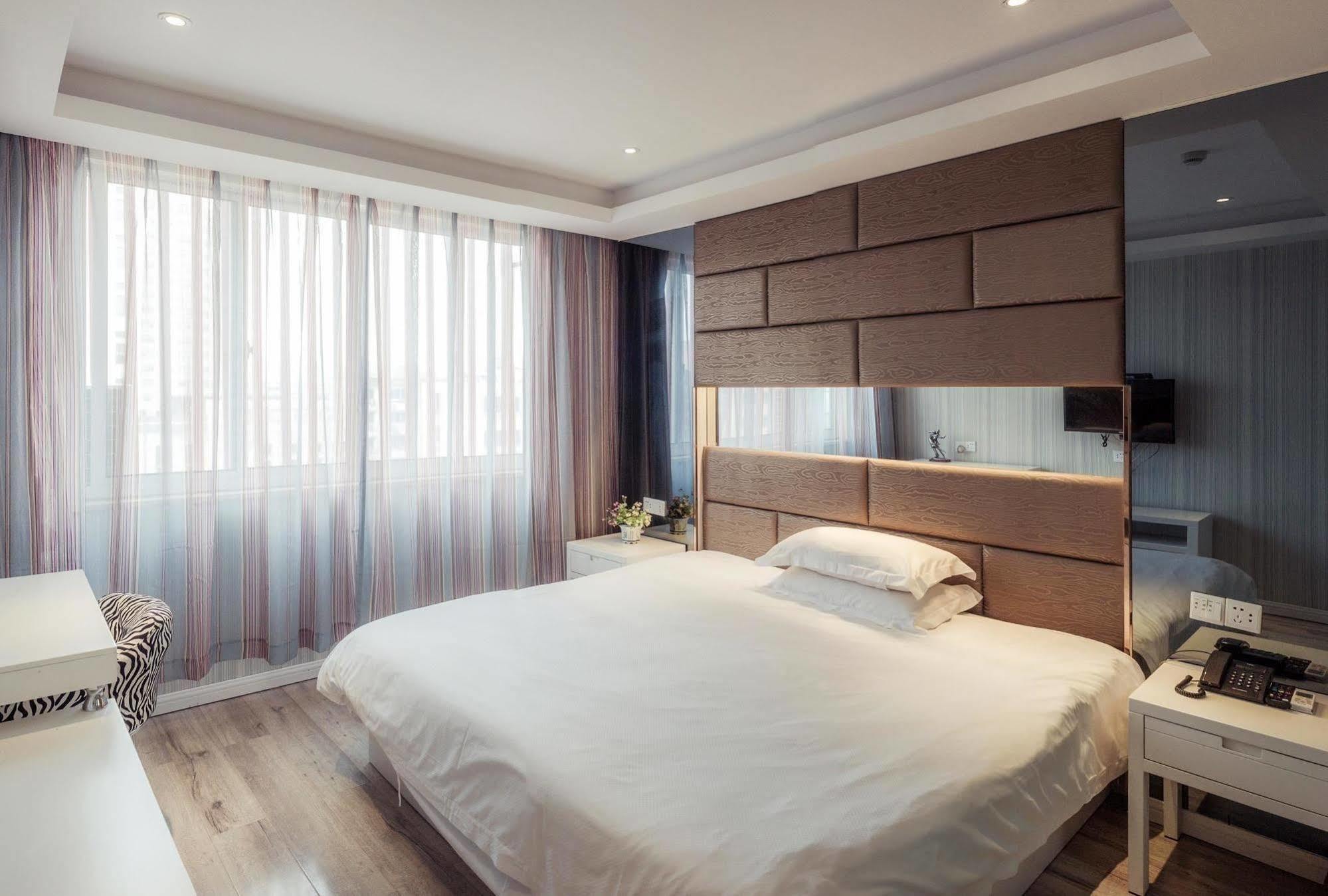 Milan Fashion Hotel Deqing Buitenkant foto